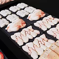 Various Fresh Meat Cuts Displayed On Trays Including Sausages Chicken Breasts And Ribs
