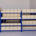 Blue Industrial Storage Racks in Warehouse Storage Area With Cardboard Boxes