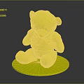 Yellow Stuffed Bear Wearing Blue Shirt With Footprints On Paws Sitting On White Base