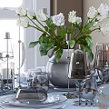 Elegant Dinnerware Set With White Flowers Vase Candles Glassware And Silver Cutlery