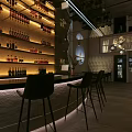 Modern Bar Interior With Stylish Counter Seating Art Projection And Ambient Lighting