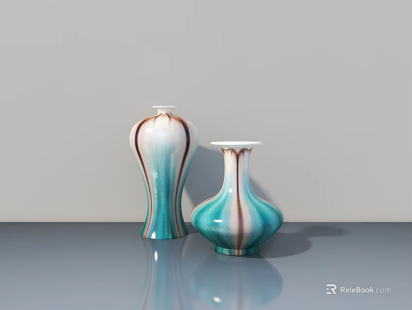 Two Ceramic Sculptures With Turquoise White Brown Striped Design On Gray Tabletop Surface 3d model