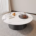 Modern Round Coffee Table With White Marble Top Black Base Oranges Tray And Book