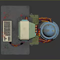 Vintage Computer Device With Gray Stand Blue Cylindrical Unit Green Coils And Colorful Wires
