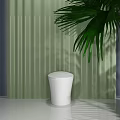 Sleek White Modern Toilet In Bathroom Interior With Green Wall And Palm Leaves