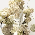 Elegant Modern White Flower Arrangements In Metal Stands And White Vases