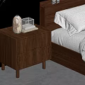 Modern Wooden Bedside Table With Two Drawers And Decorative Items On Top