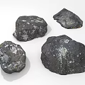 Natural Scene Featuring Scattered Black Rocks With White Spots And Rough Natural Texture