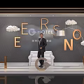 CERSNO Hotel Window Display With Man In Suit White Sofa Golden Letters And Cloud Decor