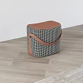 Black and White Houndstooth Stool With Brown Leather Top On Wooden Floor