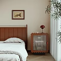 Scalloped Wooden Bedside Table With Red Lamp Framed Artwork And Potted Plant