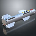 Silver Elongated Weapon With Fins And Red Yellow Top Components