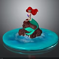Little Mermaid Figurine Sitting On Rock With Red Hair Green Tail And Blue Water Waves