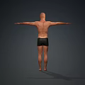 Man Standing Barefoot Shirtless in Black Shorts with Arms Outstretched Against Gray Background