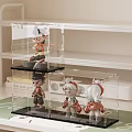 Stylish Decorative Dolls Showcased In Clear Acrylic Display Cases On Shelves