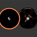 Modern Black And Orange Circular Electronic Speakers With Stylish Design