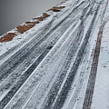 Snow Covered Road With Tire Tracks And Brown Earth In Winter Natural Scene