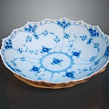 Elegant Porcelain Plate With Intricate Blue And White Carved Floral Sculptural Design
