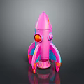 Pink Toy Rocket Model With Red Eyes And Blue Accents On Black Background
