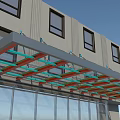 Modern Building Entrance Awning With Metal Frame And Colorful Beams Over Glass Doors