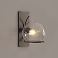 Modern Wall Sconces with Circular Metal Frame and Glass Shade on Light Wall