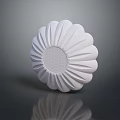 White Flower Shaped Sculpture with Radial Texture and Grid Pattern Center on Dark Reflective Surface
