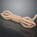 Beige Coiled Rope as Daily Living Essential on Black Smooth Surface with Reflection