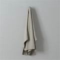 Beige Knitted Textured Towel Hanging On Wall For Simple Daily Use