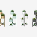 Modern Garden Decor With Golden Multi Tiered Plant Stands White Flowers And Green Foliage