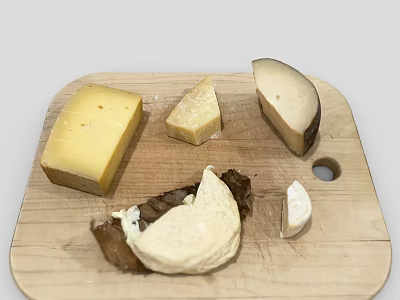 Assorted Cheeses On Wooden Cutting Board With Different Shapes And Textures 3d model