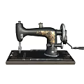 Vintage Industrial Sewing Machine With Black Metal Body Gold Decorative Patterns And Manual Hand Crank