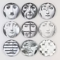 Multiple Artistic Circular Badges Featuring Abstract Black And White Face Patterns