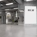 Modern Industrial Style Clothing Store With Cozy Lounge And Sleek Cement Interior Design