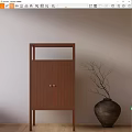 Wooden Decorative Cabinet With Metal Handles And Black Vase Branches Against Beige Wall