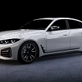 White Modern Sedan Car With Sleek Front Grille Design And Black Alloy Wheels