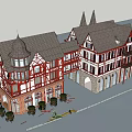 Red White Half Timbered Commercial Complex With Gabled Roofs Multi Story Retail Spaces And Greenery