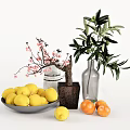 Decorative Vase With Cherry Blossom And Olive Branch Alongside Lemon Bowl And Fresh Oranges