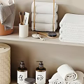 Neatly Stacked Towels In Bathroom With Storage Baskets And Toiletries
