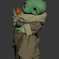 Green Alien Character In Brown Robe Holding Orange Fruit From Popular Sci Fi Series
