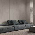 Modern Gray Sofa And Round Coffee Table Set With Wooden Wall And Plant