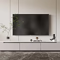 Modern Minimalist White TV Stand with Flat Screen TV Green Plant and Decorative Drawers