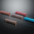 Five Various Colored Wooden Public Long Benches on Black Background