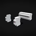 White Electrical Circuit Breakers And Safety Components On Black Surface