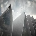 Modern Metallic Leaf Shaped Museum Building with Textured Facade in Urban Square