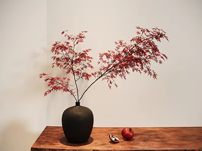 Black Ceramic Vase With Red Maple Branches On Wooden Table And Sliced Pomegranate White Wall 3d model