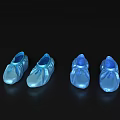 Four pairs of blue semi transparent shoes on black background