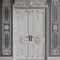 Elegant White Double Doors With Carved Patterns Golden Handle And Ornate Wall Panels