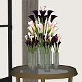 Glass Vase with Purple and White Calla Lilies on Round Metal Table with Natural Light