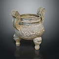 Ancient Bronze Tripod Cauldron With Intricate Carvings Decorative Handles And Three Legs