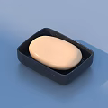 Cream Colored Soap Placed In Black Square Soap Dish For Daily Use
